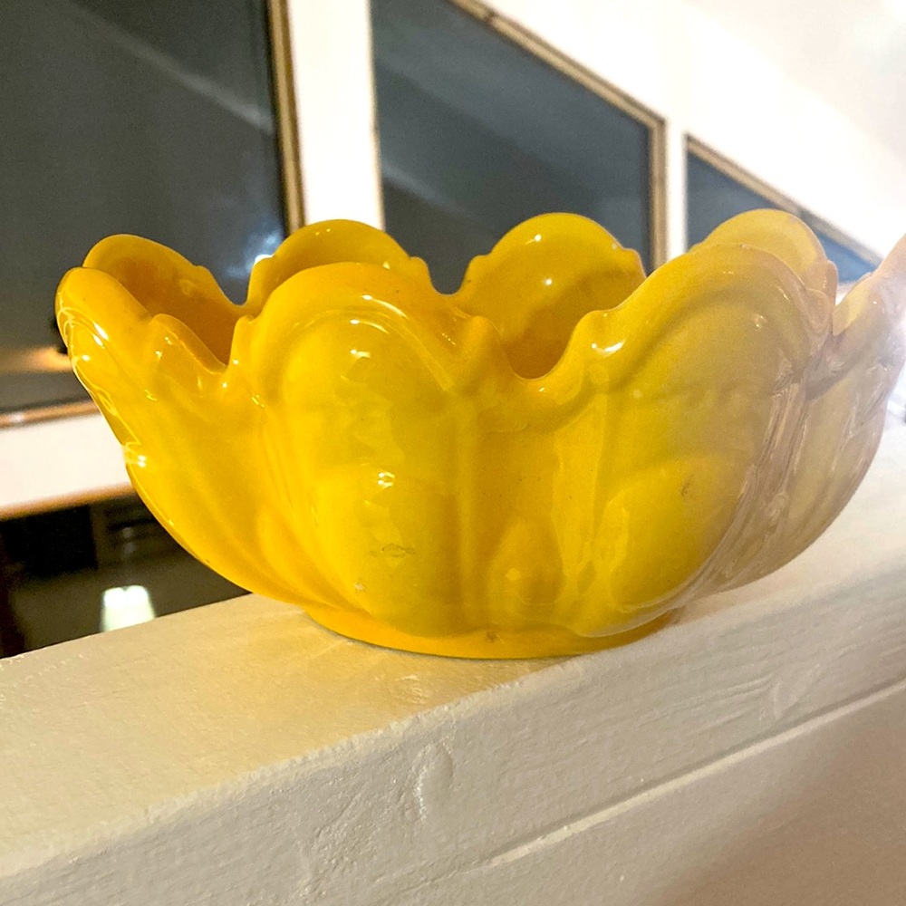 Art deco amazing yellow numbered signed planter. Does it depict frogs?